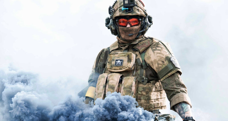 A-18 Goliath-G plate carrier operator in tactical gear with smoke