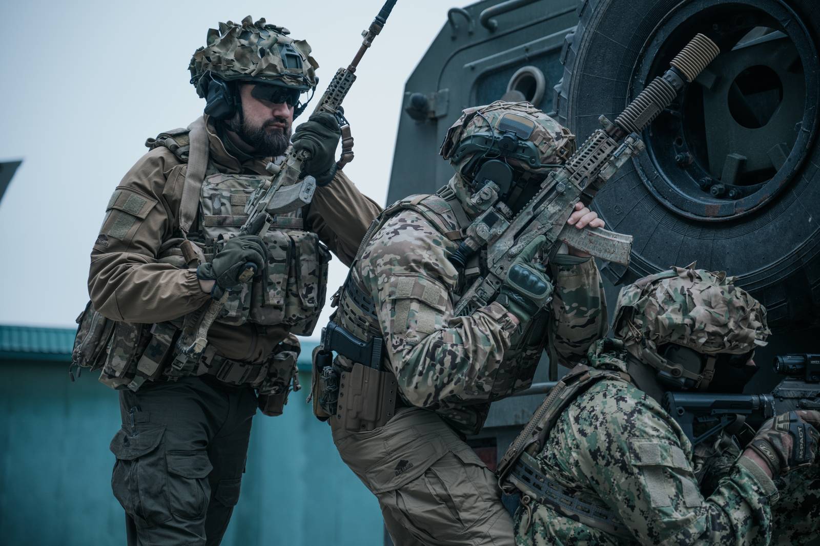 Tactical operators with armored vehicle